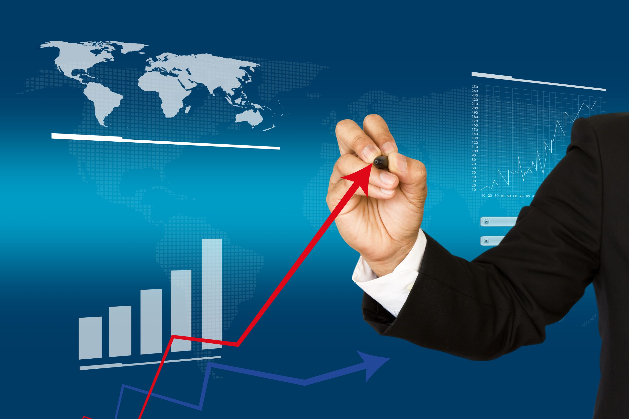 Businessman drawing a business growth graph on a transparent board