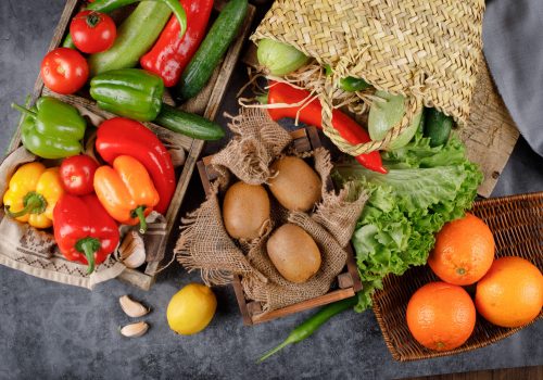 Kiwies, oranges and colorful bell peppers.